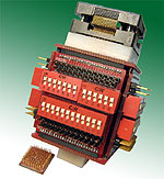 Vertical pin/signal isolator for 100 pin Rectangular SMT components.