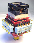 Vertical signal isolator for 48 pin QFP square SMT components.