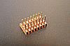 SOIC 16 pin array base for SMT Pads provides access for test socket attachment.