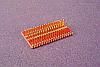 SOIC 36 pin array base for SMT Pads provides access for test socket attachment.